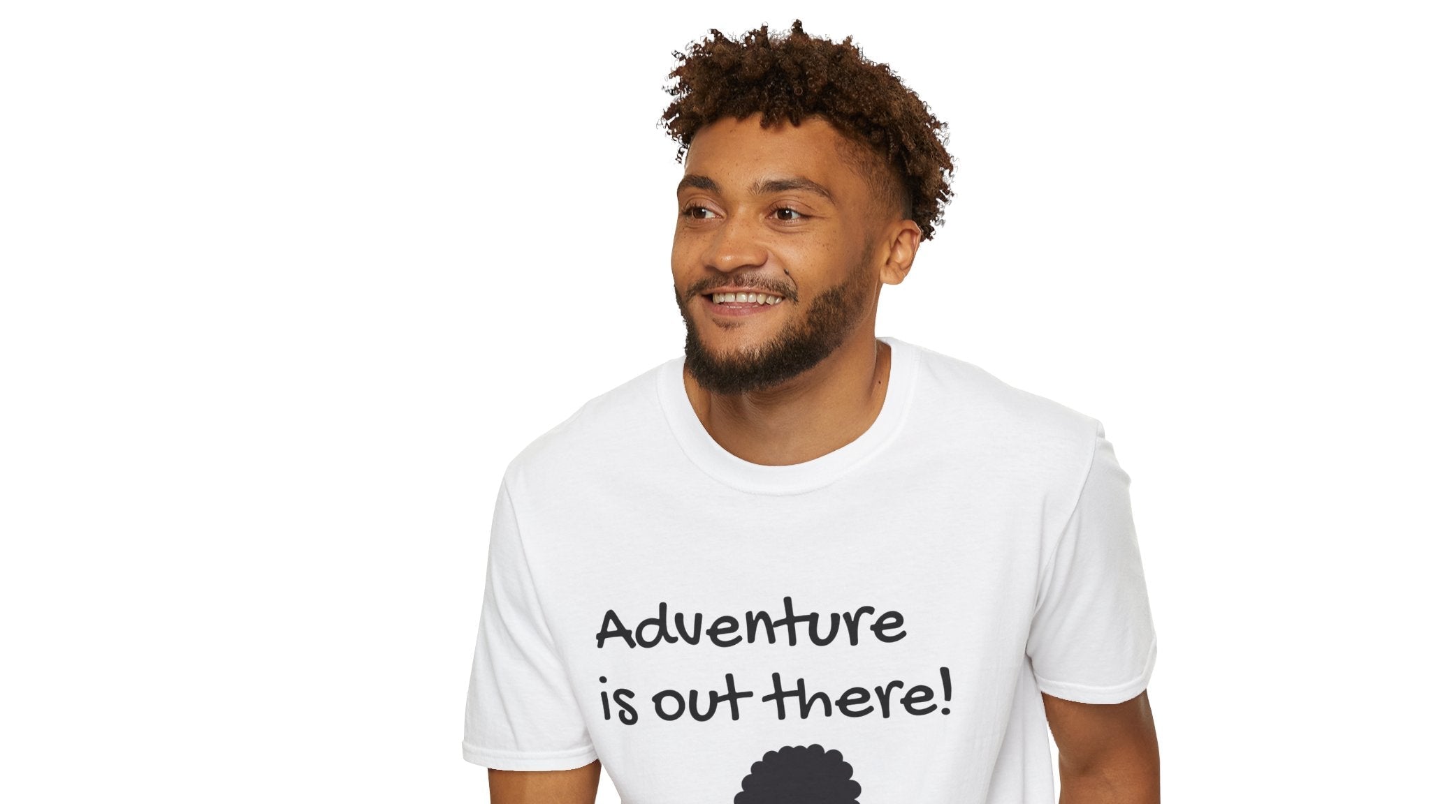 Man wearing a white t-shirt with 'Adventure is out there!' text and graphic, sitting on a white stool.